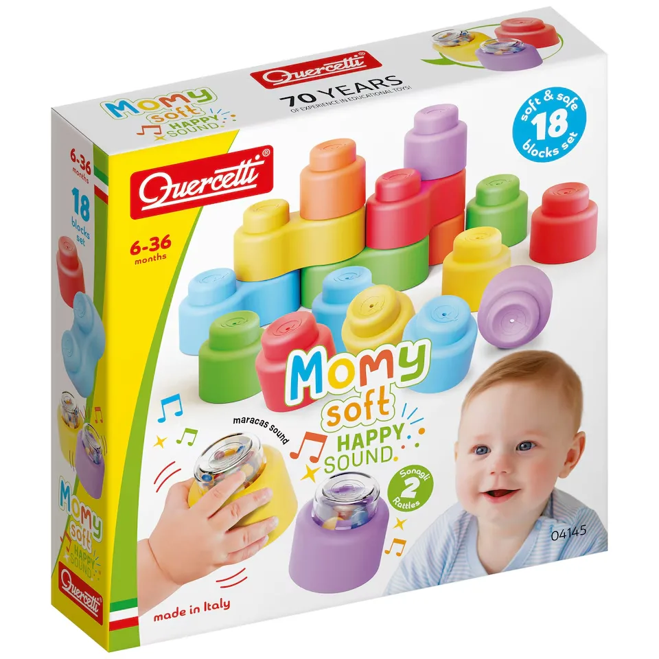 Close-up of yellow Quercetti Momy soft rattle block with clear capsule filled with multicoloured beads producing a maracas sound