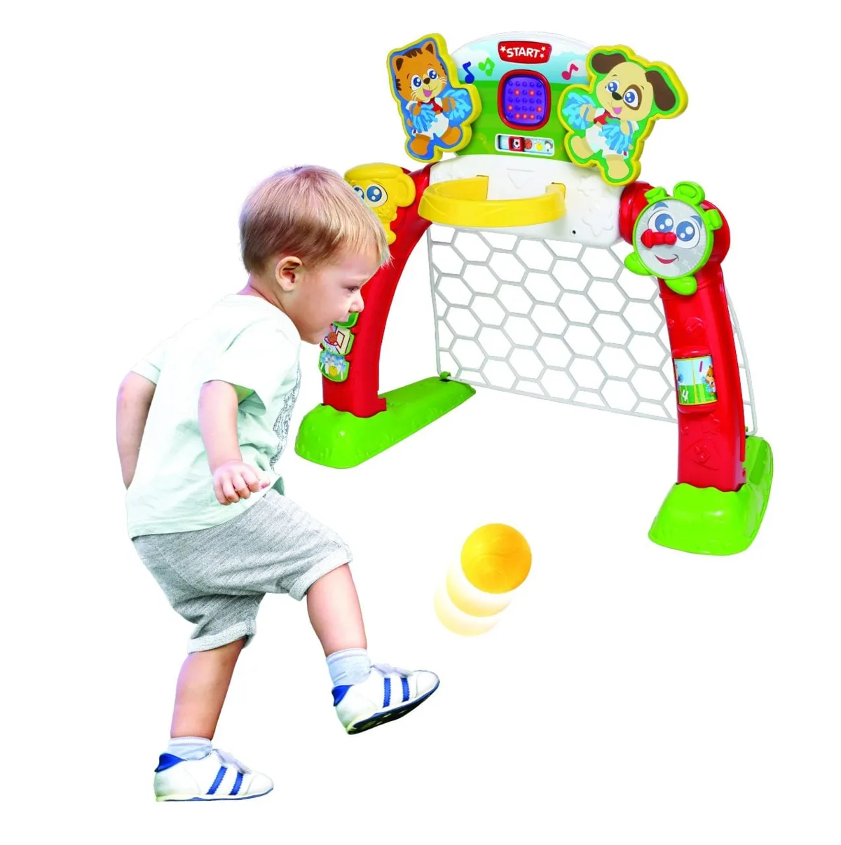 WinFun 4-in-1 Sports Centre toddler sports centre with LED scoreboard, toddler boy kicking yellow ball towards goal, ages 18 months plus