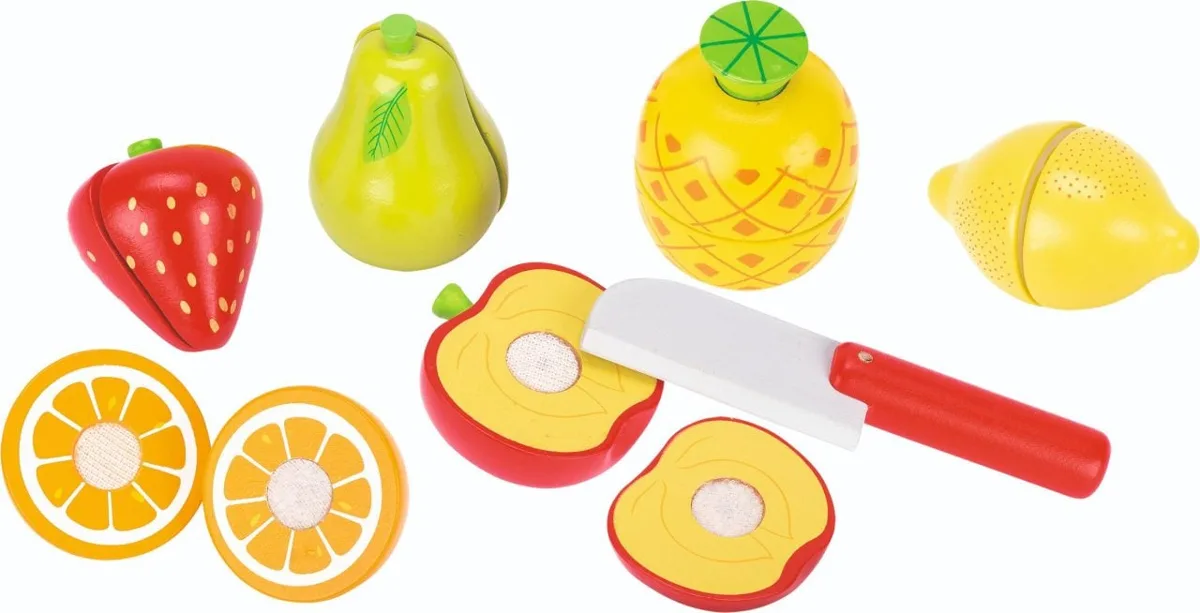 The Goki Cutting Fruit Set, showing a wooden toy knife and several pieces of sliceable wooden fruit like an apple, orange, and pineapple.