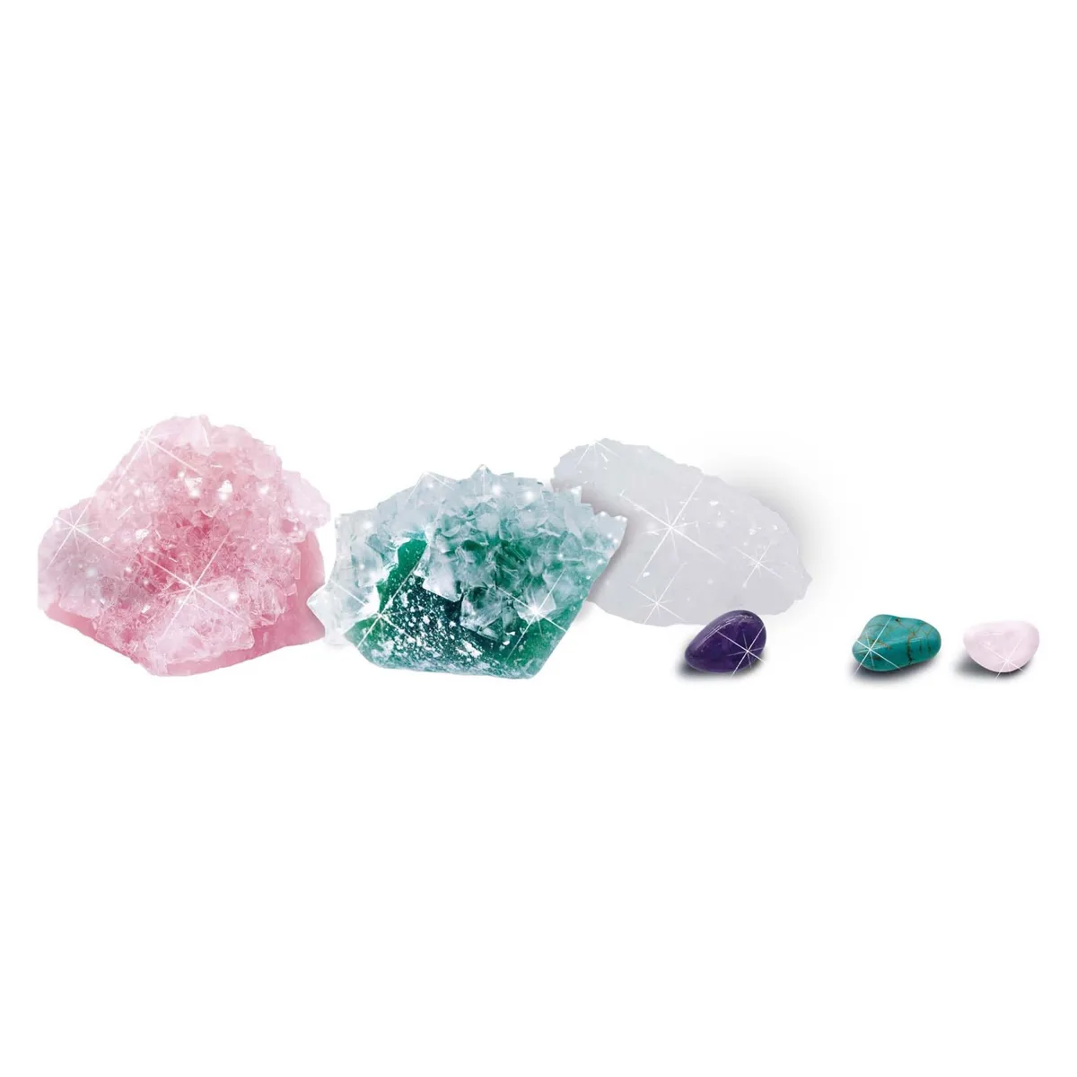 SES Creative Growing Crystals kit contents showing three large crystal clusters in pink, green and white alongside three tumbled gemstones including amethyst and turquoise.