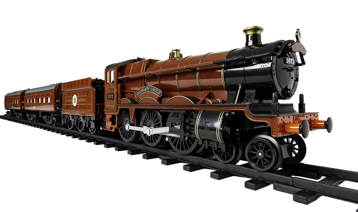 Lionel Hogwarts Express battery-operated train set showing locomotive number 5972, tender and two passenger coaches on oval track