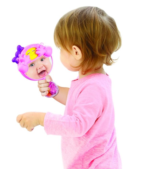 Fashion Tot Beauty Gift Set. Toddler playing with the mirror.