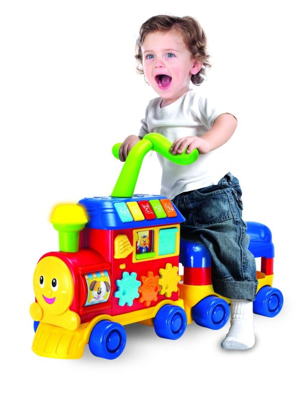 Toddler riding on the Walker Ride-On Learning Train. Product image.