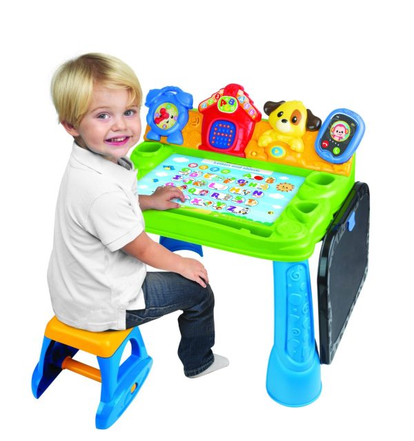 Child seated at the Smart Touch 'N Learn Activity Desk