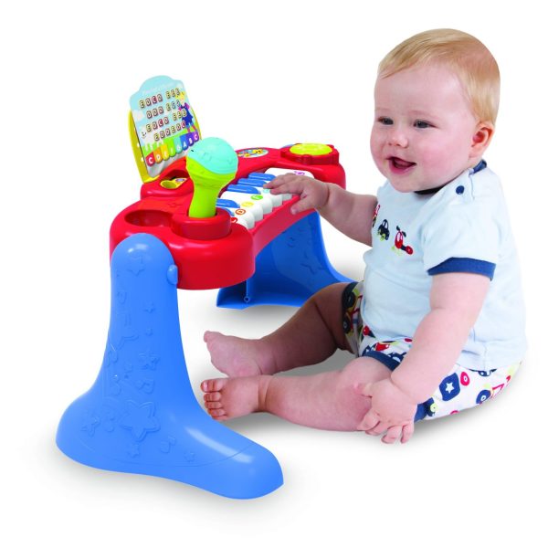 Baby playing on toy keyboard, the "Baby Music Center".