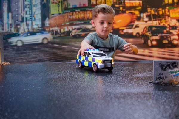 Nikko UK Rush and Rescue 12" - 30 cm Police SUV. Young boy playing with toy police car.