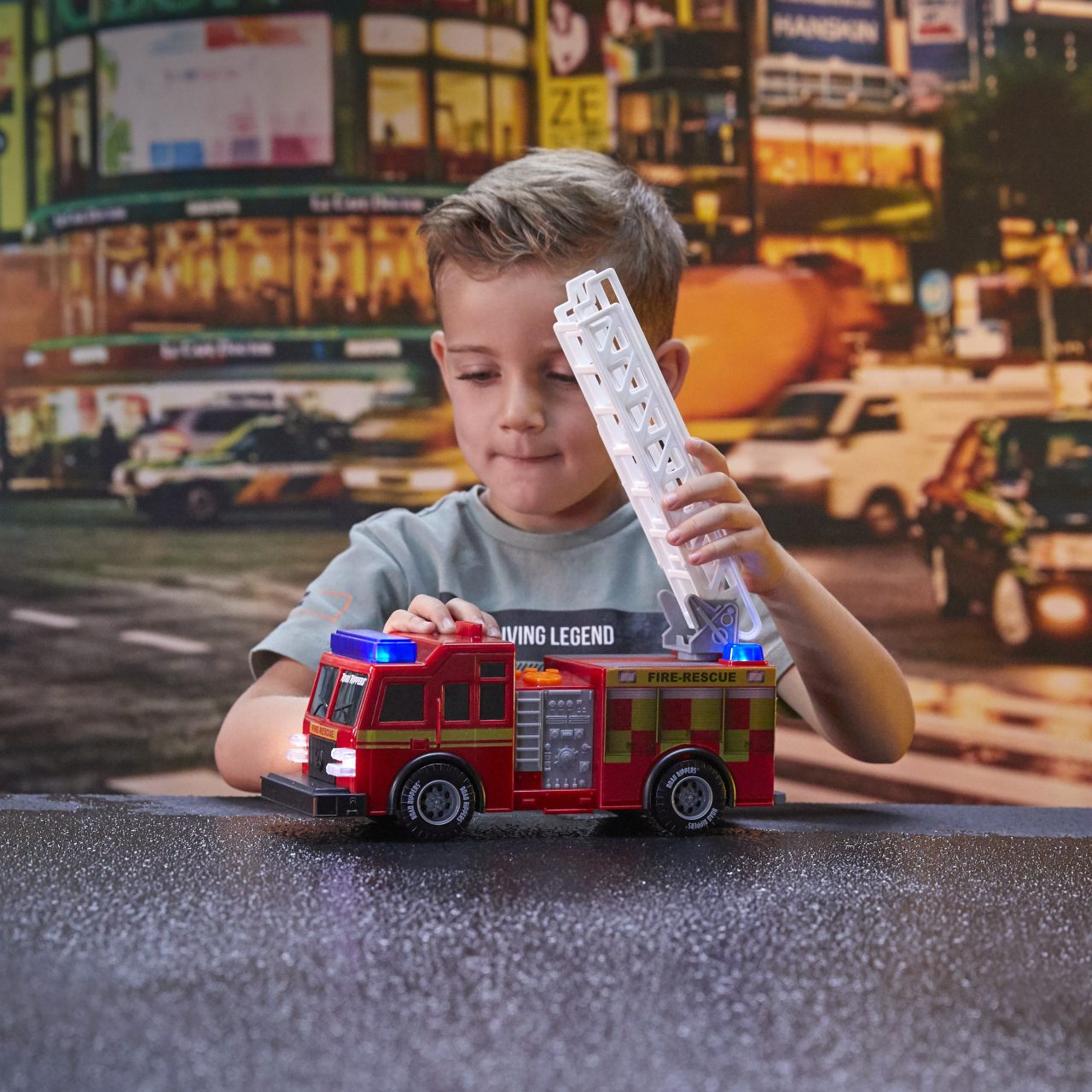 Nikko UK Rush and Rescue 12" - 30 cm Fire Truck. Young boy playing with the toy.