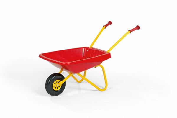 Rolly Wheelbarrow (Red and Yellow Metal) - Child playing with the toy wheelbarrow in a garden.