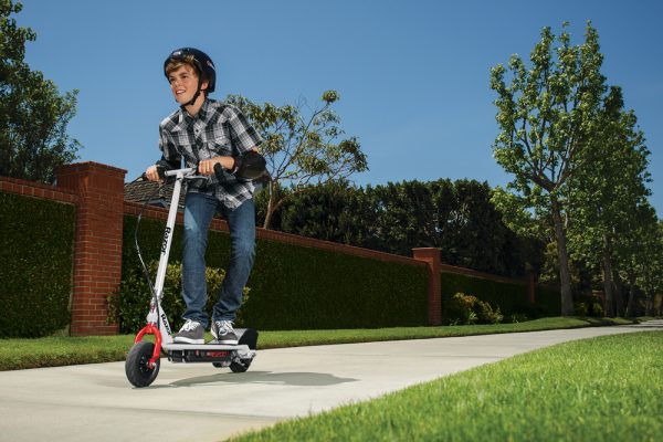 E200 Electric Scooter - Red/White. Outdoor scene, boy riding the scooter.