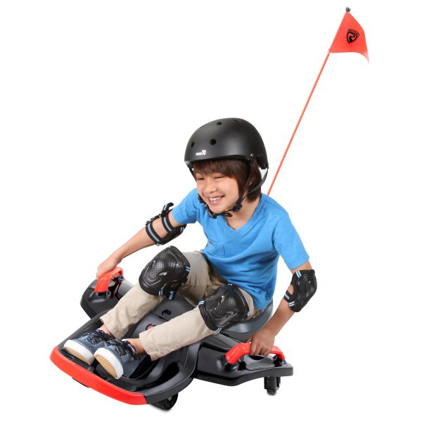 Rollplay Nighthawk Bolt 12V. Young boy riding the Rollplay Nighthawk Bolt - with helmet and protective gear on.