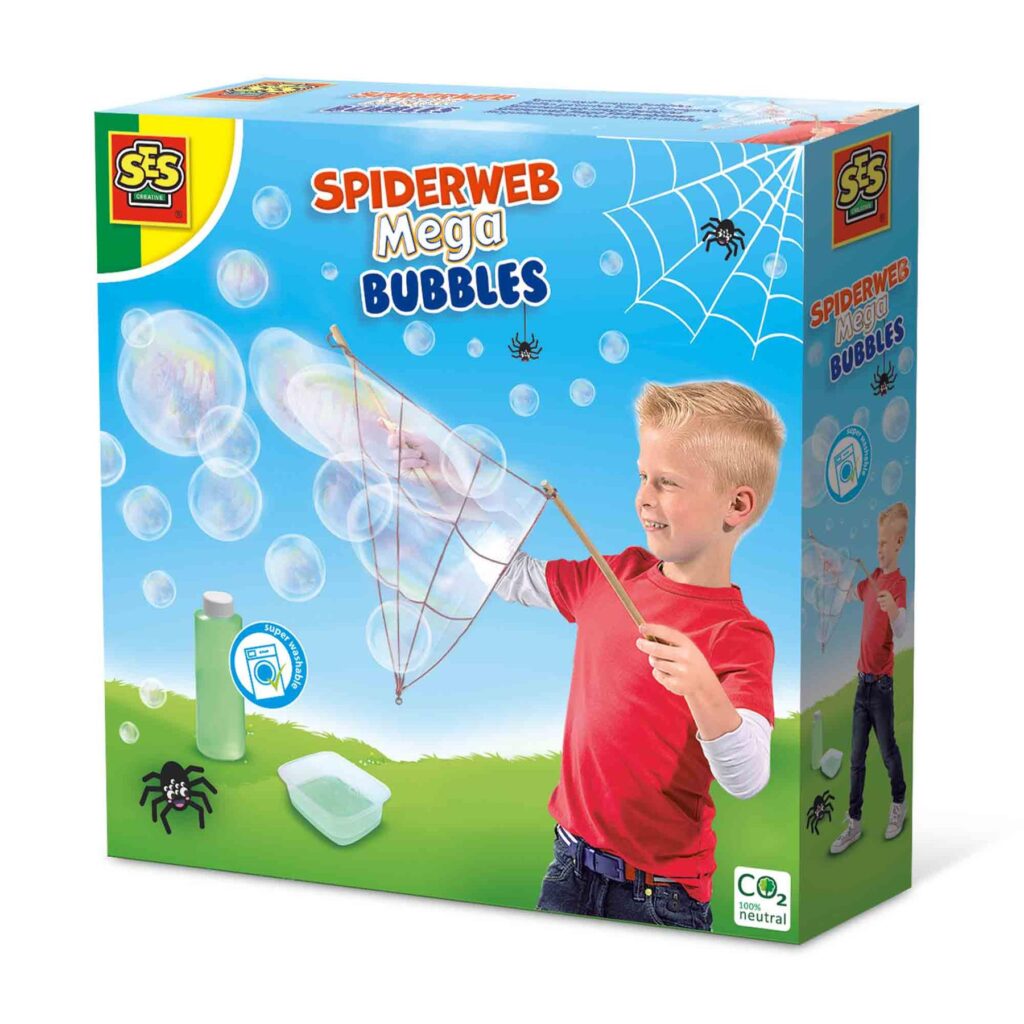A child using the spiderweb-shaped bubble wand from the SES Creative Spiderweb Mega Bubbles set to create a cloud of large bubbles outdoors.