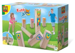 The SES Creative Kubb Jr game set up on a lawn, with children throwing wooden batons at the animal-themed king and kubbs.