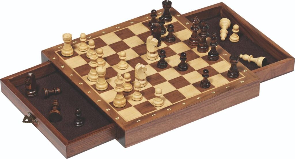 The Goki Magnetic Chess Set with Drawers, a wooden board shown with a game in progress and its two felt-lined storage drawers pulled out.