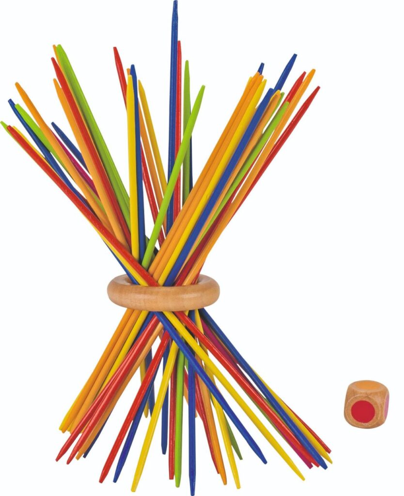 The Goki Colour Ring Mikado game, showing a bundle of colourful sticks standing upright, held together by a wooden ring, with a colour die next to it.
