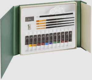 The Nassau Fine Art 21-piece Acrylic Art Set, opened to show the twelve tubes of paint, various brushes, palette, and other accessories in a green presentation box.