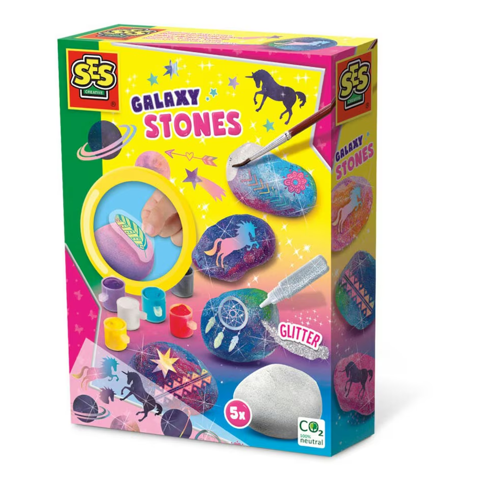 The SES Creative Painting Galaxy Stones kit, showing the included stones, paints, glitter glue, and celestial rub-on transfers.