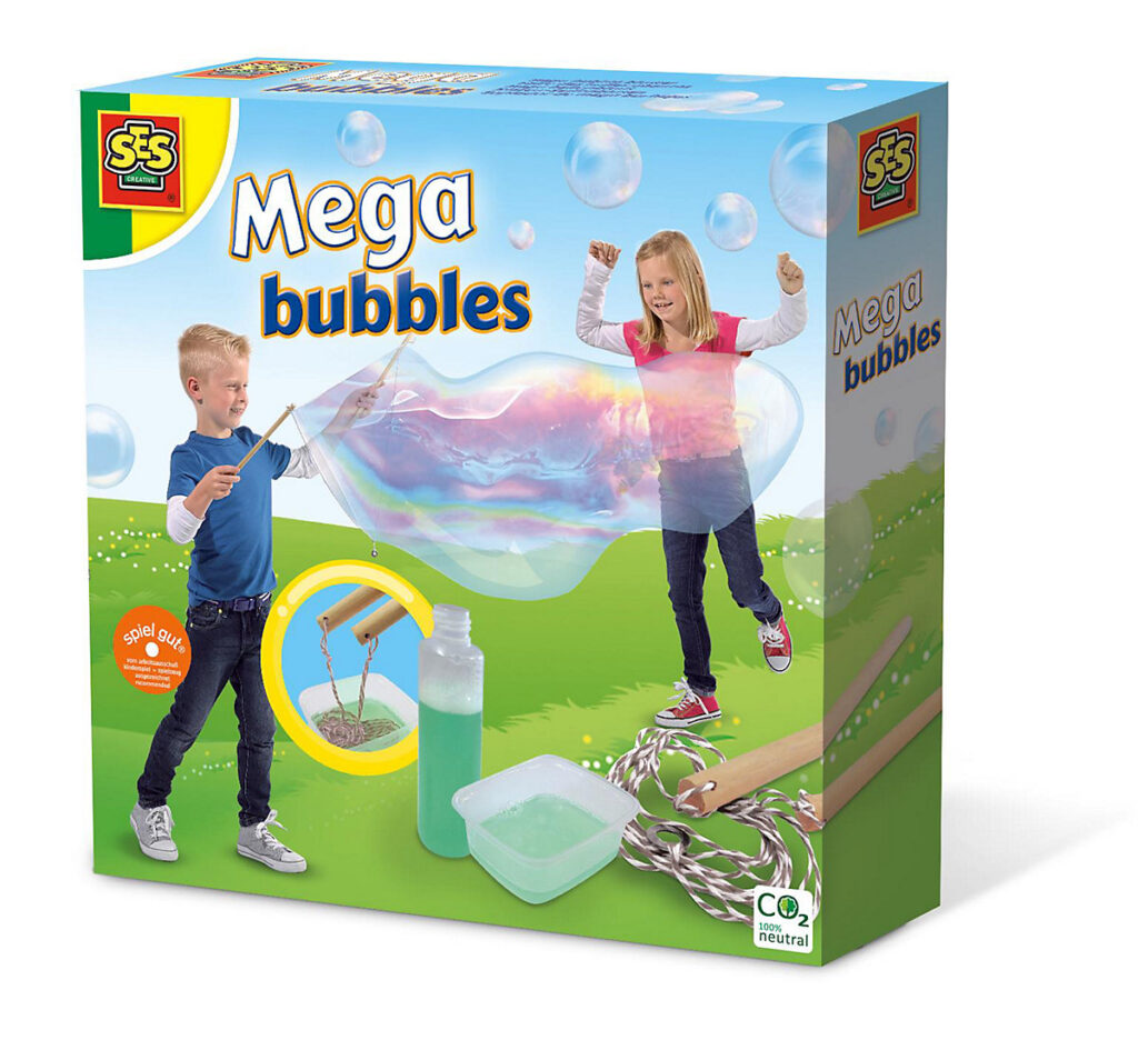 Children in a garden using the SES Creative Mega Bubbles kit with sticks and a rope to create a single giant bubble.