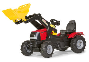 The Rolly Toys Case Puma 225 CVX pedal tractor, a large red ride-on toy for children, complete with a working front loader and pneumatic tyres.