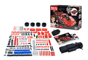 The Buki Build & Drive RC Sports Car kit, showing the 315 construction pieces, remote controller, and the finished red remote-controlled supercar.