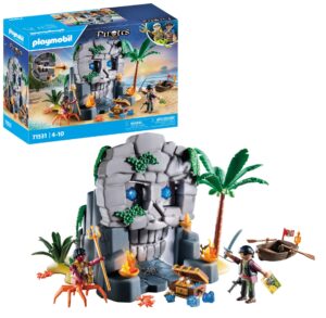 Playmobil pirate adventure toy with a skull-shaped rock cave, two figures, a rowboat, and treasure accessories for children.