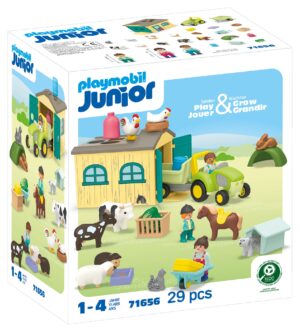 Playmobil JUNIOR Farm Adventure playset with a green tractor, farm building, and domestic animals for toddlers.